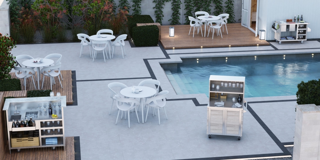 White tables and chairs along with stainless steel service stations surrounding an outdoor pool