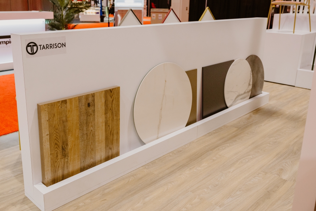 Part of a tradeshow booth with different styles of tabletops on display